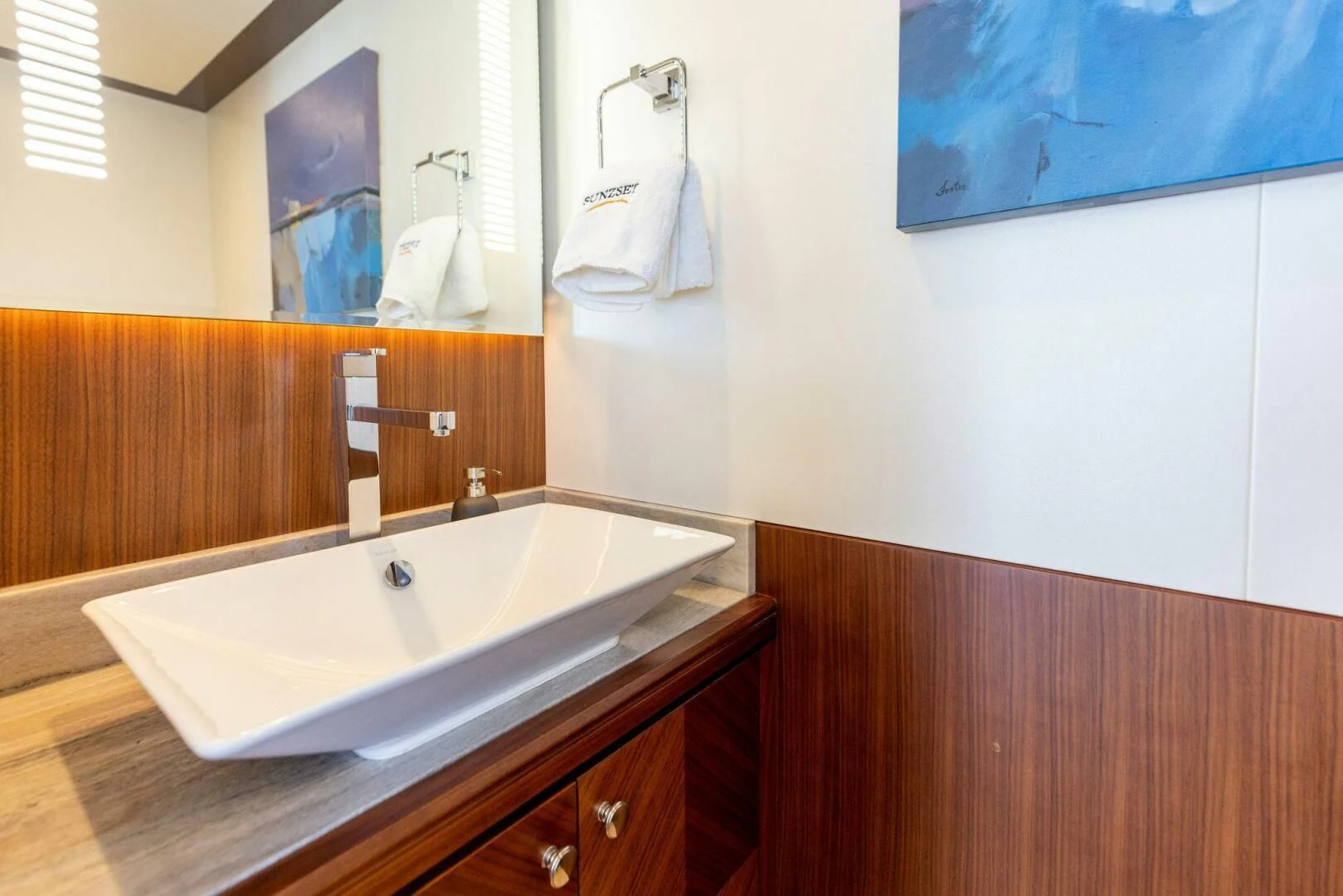 a bathroom with a sink and a mirror aboard CLAYMAKER Yacht for Sale