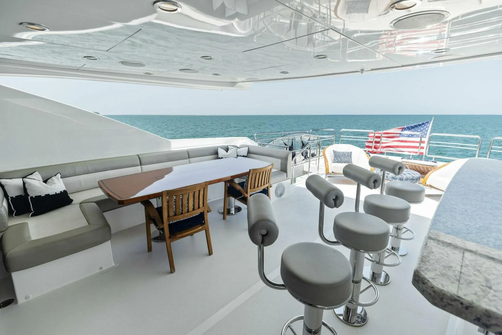 a room with tables and chairs aboard CLAYMAKER Yacht for Sale