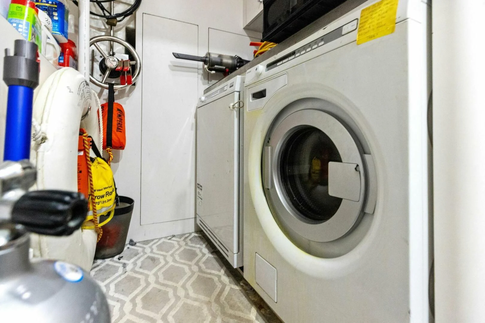 a white washing machine aboard CLAYMAKER Yacht for Sale