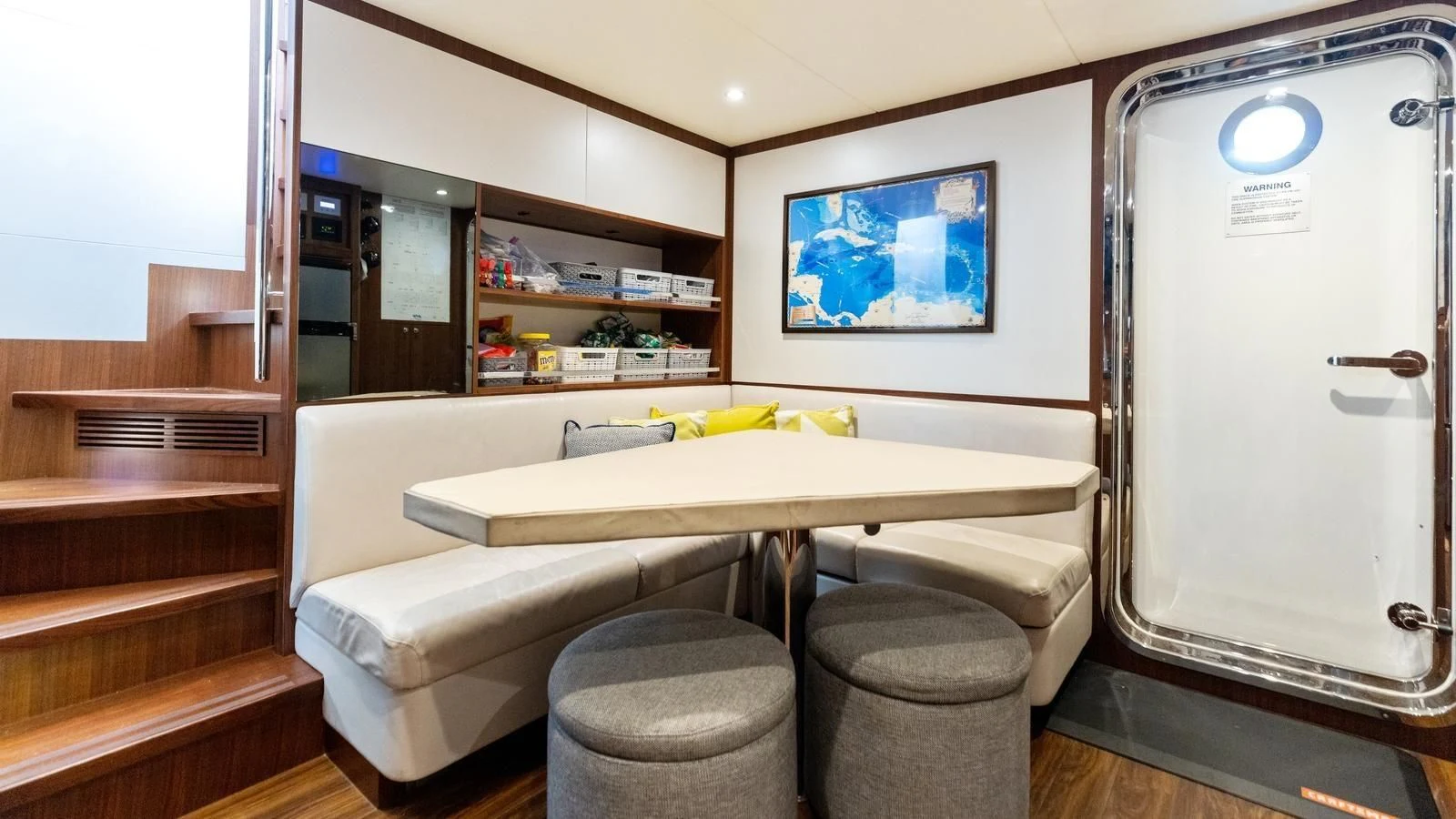 a room with a table and a toilet aboard CLAYMAKER Yacht for Sale