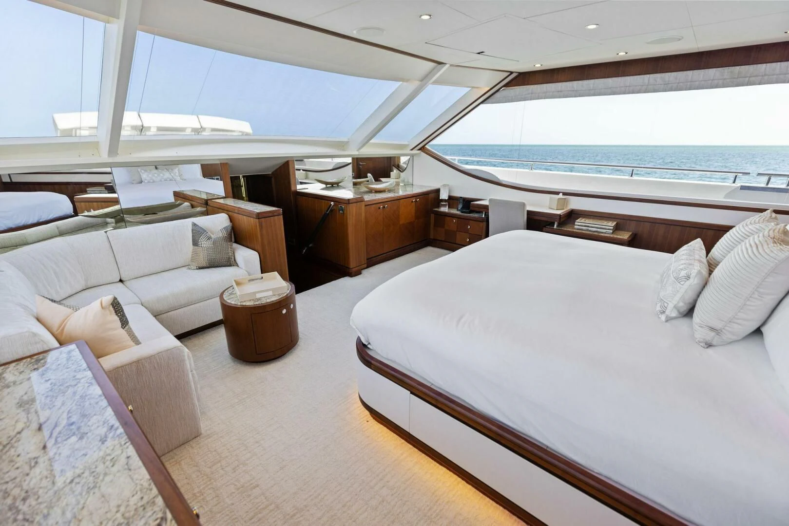 a room with a bed and a table aboard CLAYMAKER Yacht for Sale