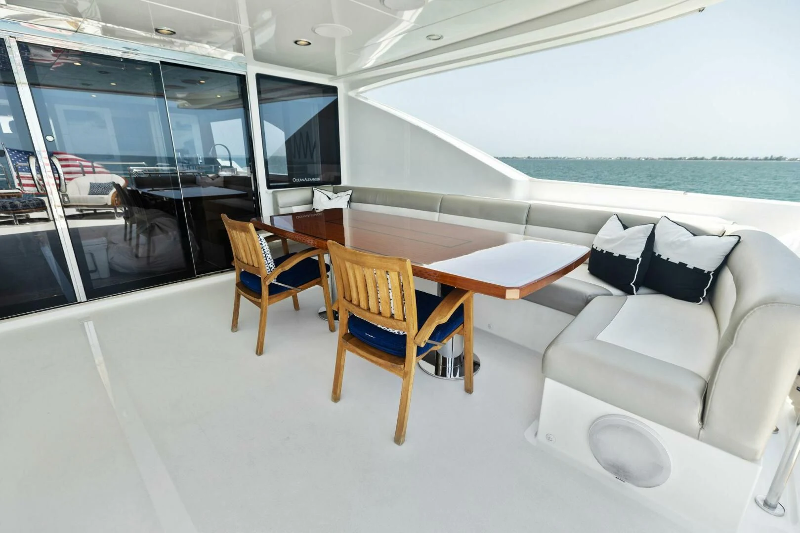a room with a couch and a table and chairs aboard CLAYMAKER Yacht for Sale
