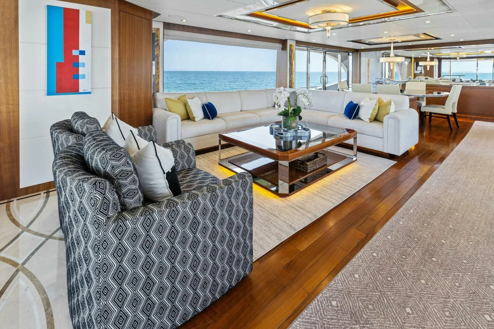 a living room with a large window aboard CLAYMAKER Yacht for Sale