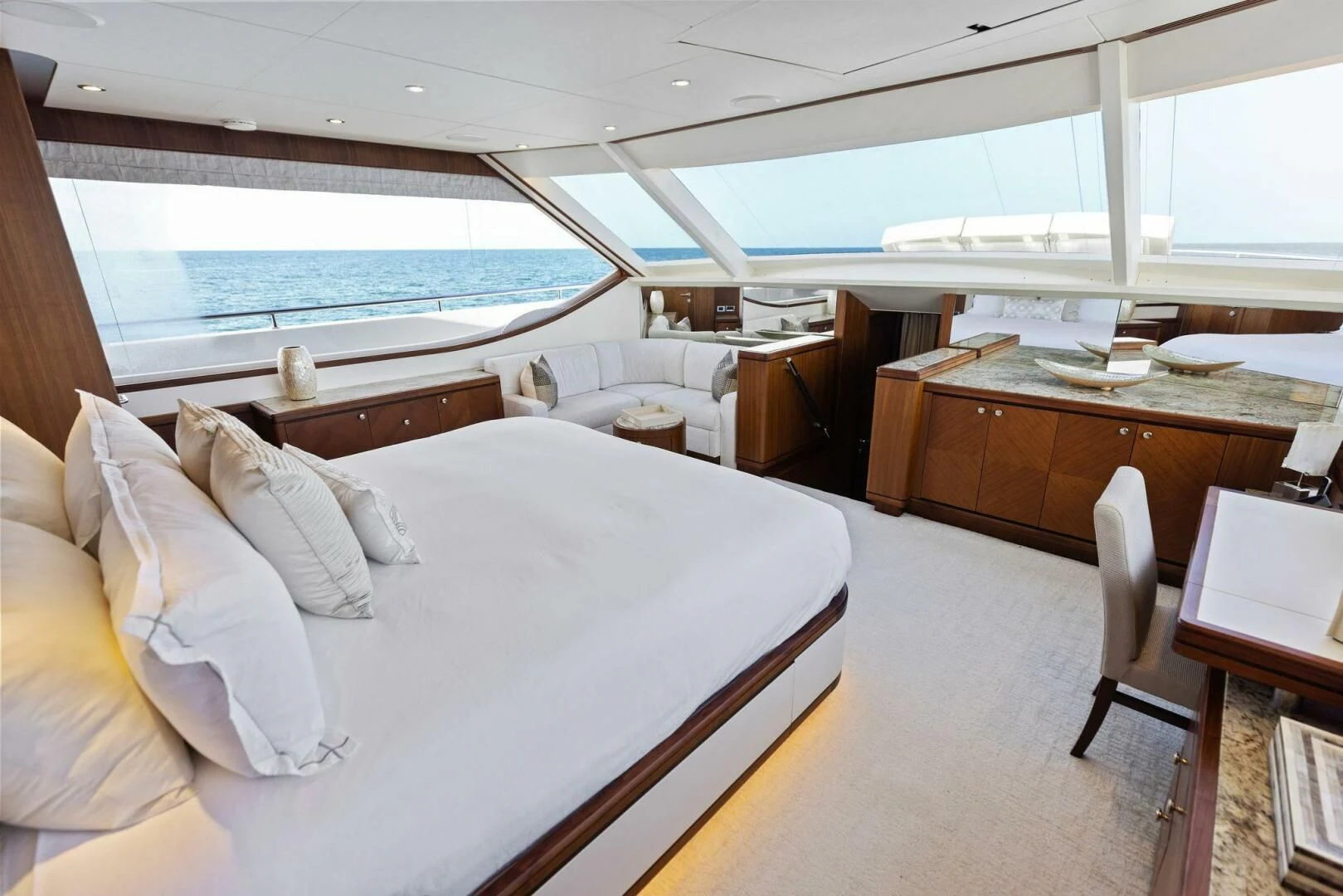 a room with a bed and a table aboard CLAYMAKER Yacht for Sale
