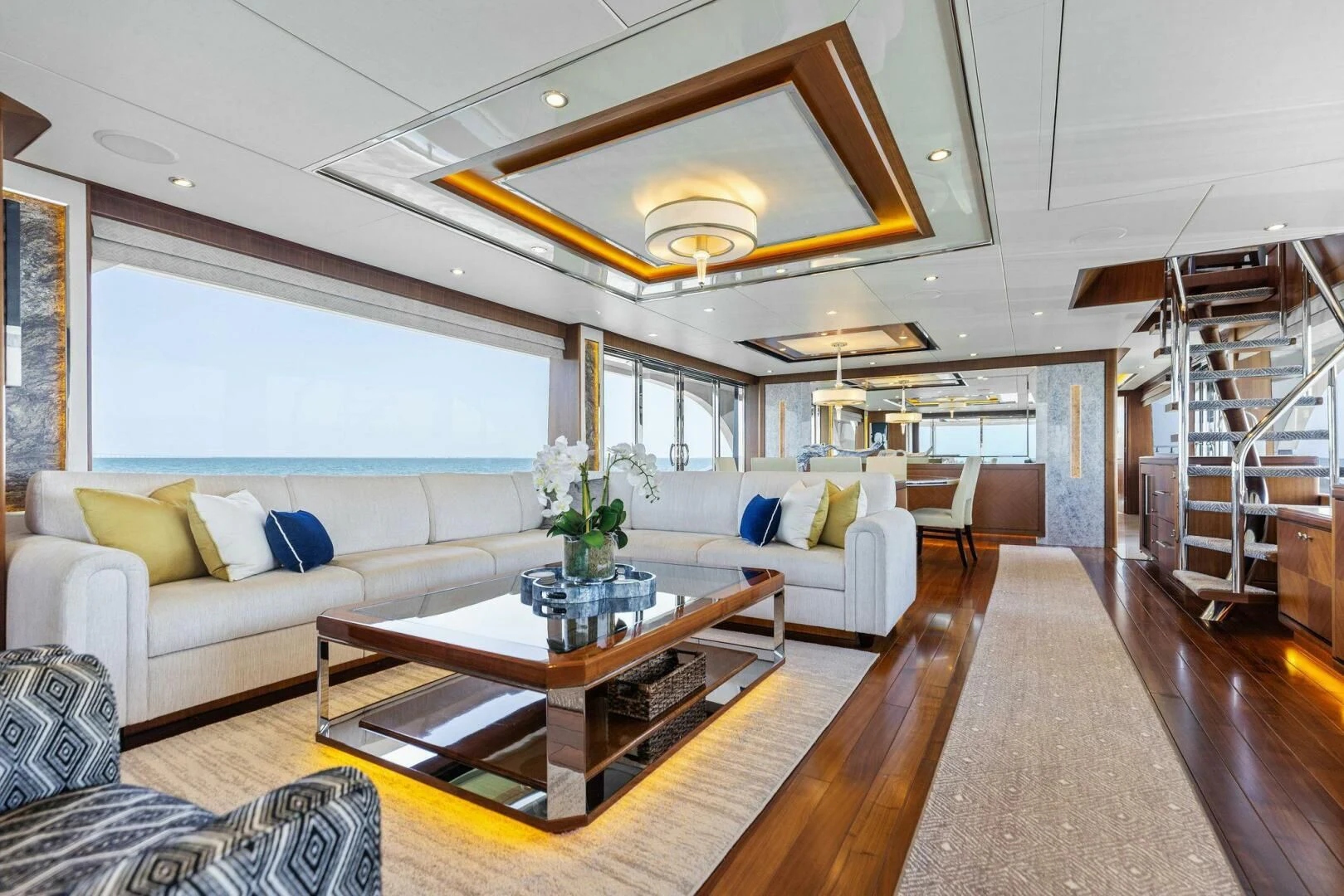 a living room with a large open window aboard CLAYMAKER Yacht for Sale