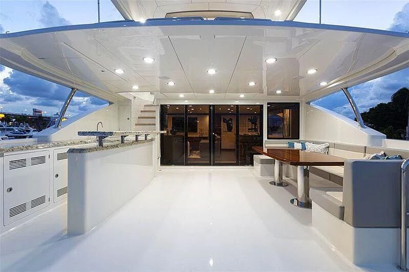 a large room with a long table and chairs aboard CLAYMAKER Yacht for Sale