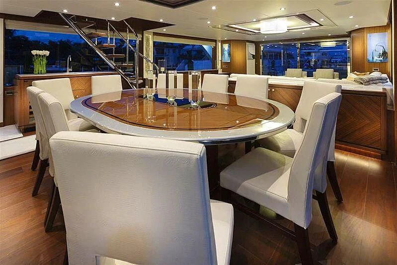 a room with a table and chairs aboard CLAYMAKER Yacht for Sale