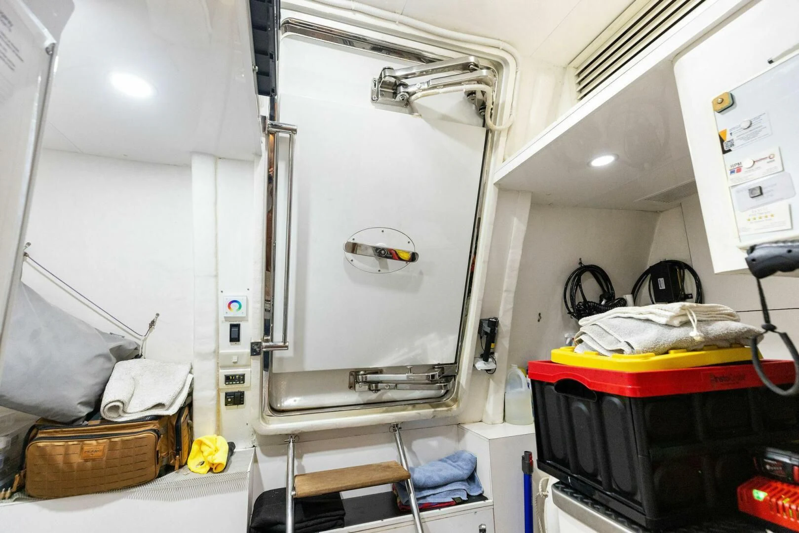 a room with a large mirror and luggage aboard CLAYMAKER Yacht for Sale