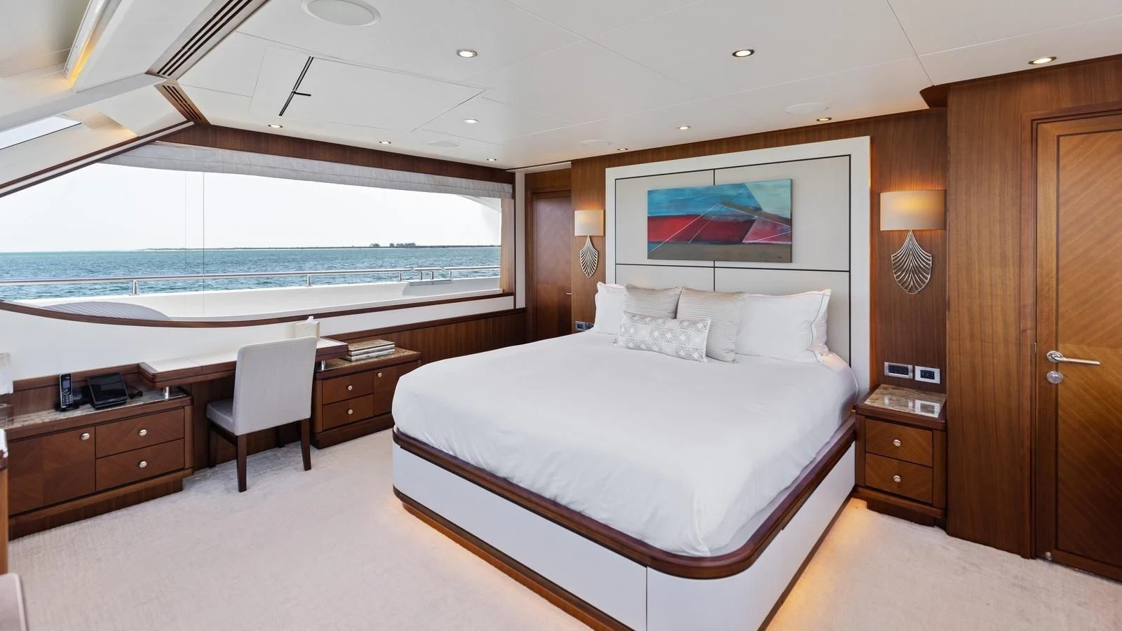 a hotel room with a bed and desk aboard CLAYMAKER Yacht for Sale