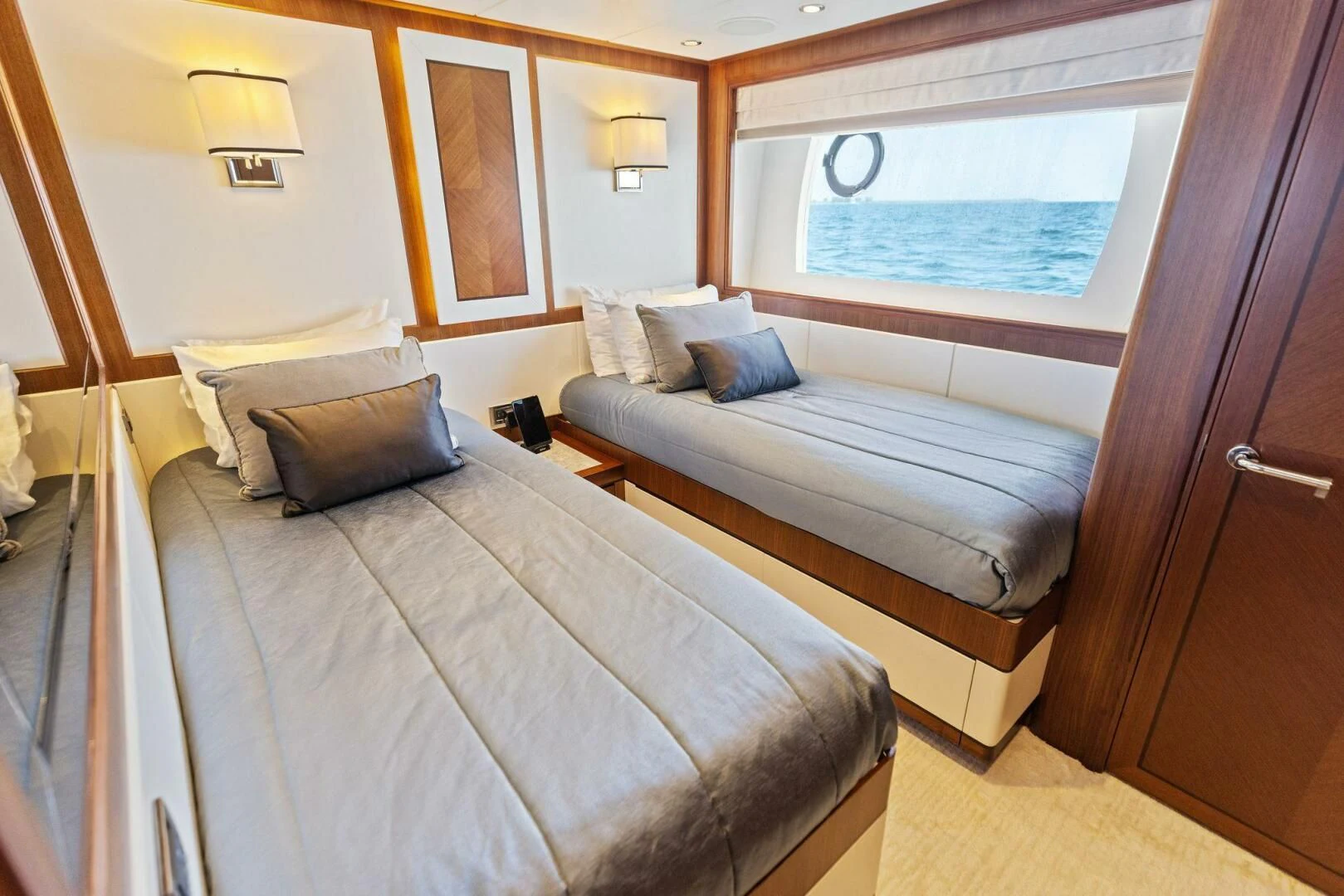a room with a bed and a window aboard CLAYMAKER Yacht for Sale