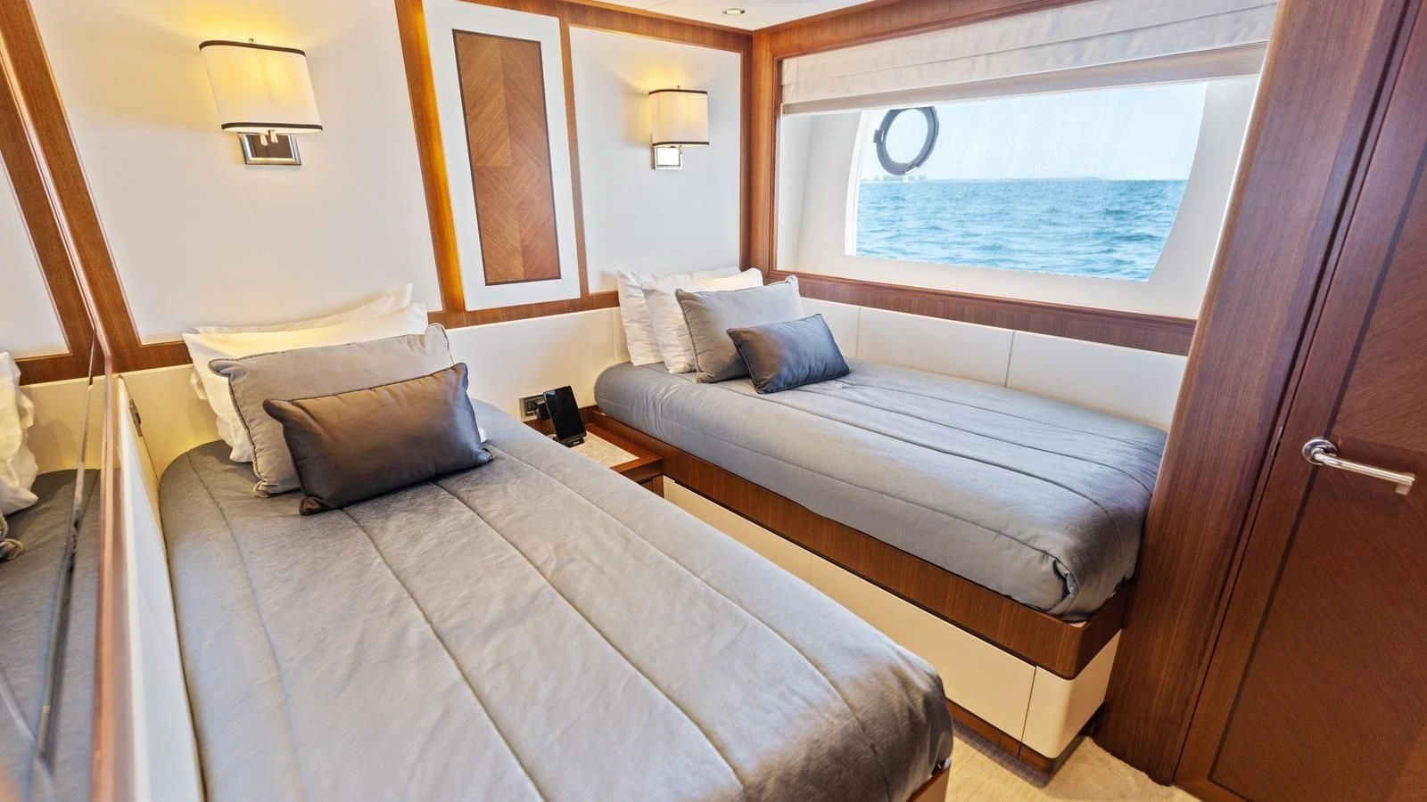 a couple of beds in a room aboard CLAYMAKER Yacht for Sale