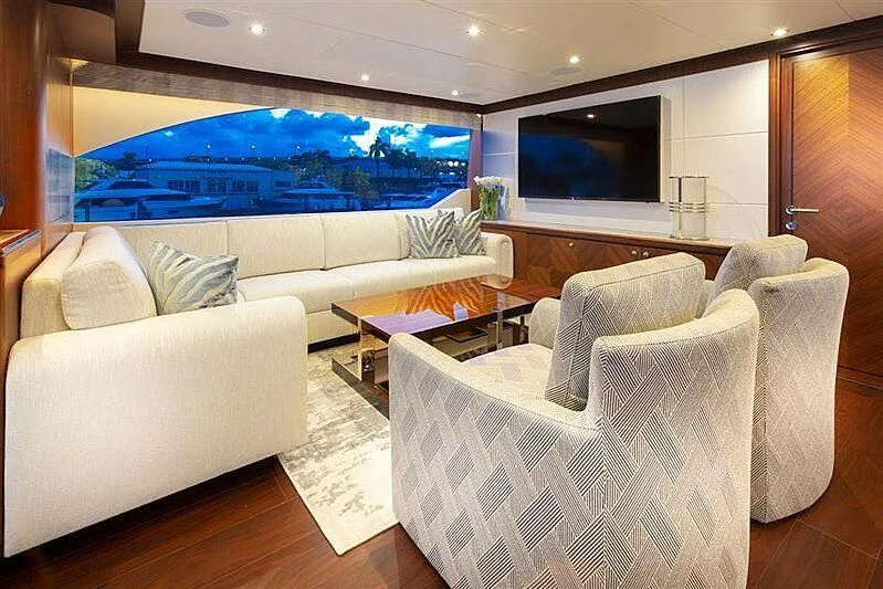 a living room with a large screen aboard CLAYMAKER Yacht for Sale