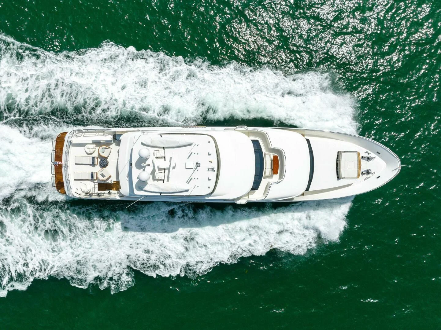a bottle of beer on a wave aboard CLAYMAKER Yacht for Sale