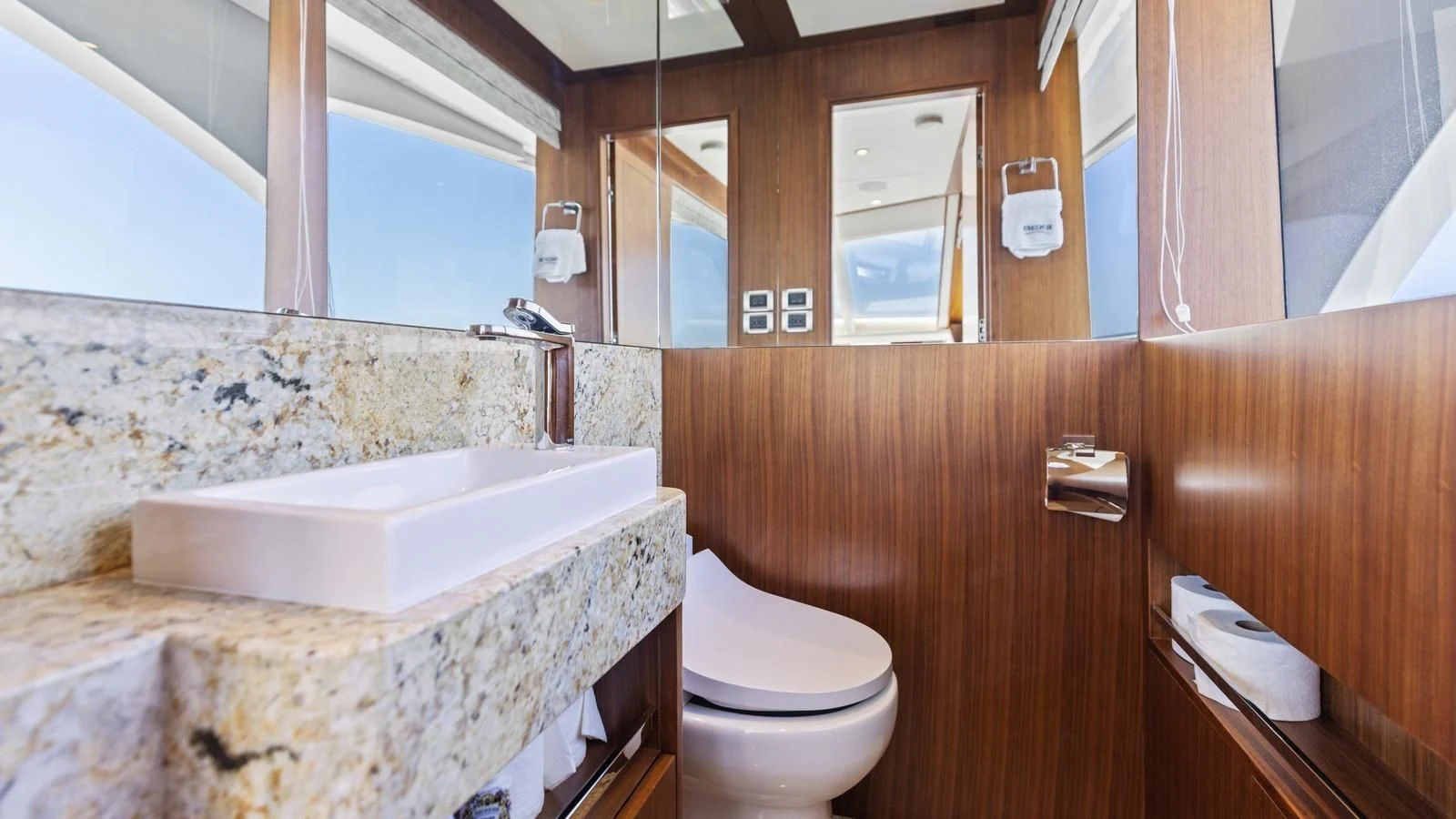 a bathroom with a tub toilet and sink aboard CLAYMAKER Yacht for Sale