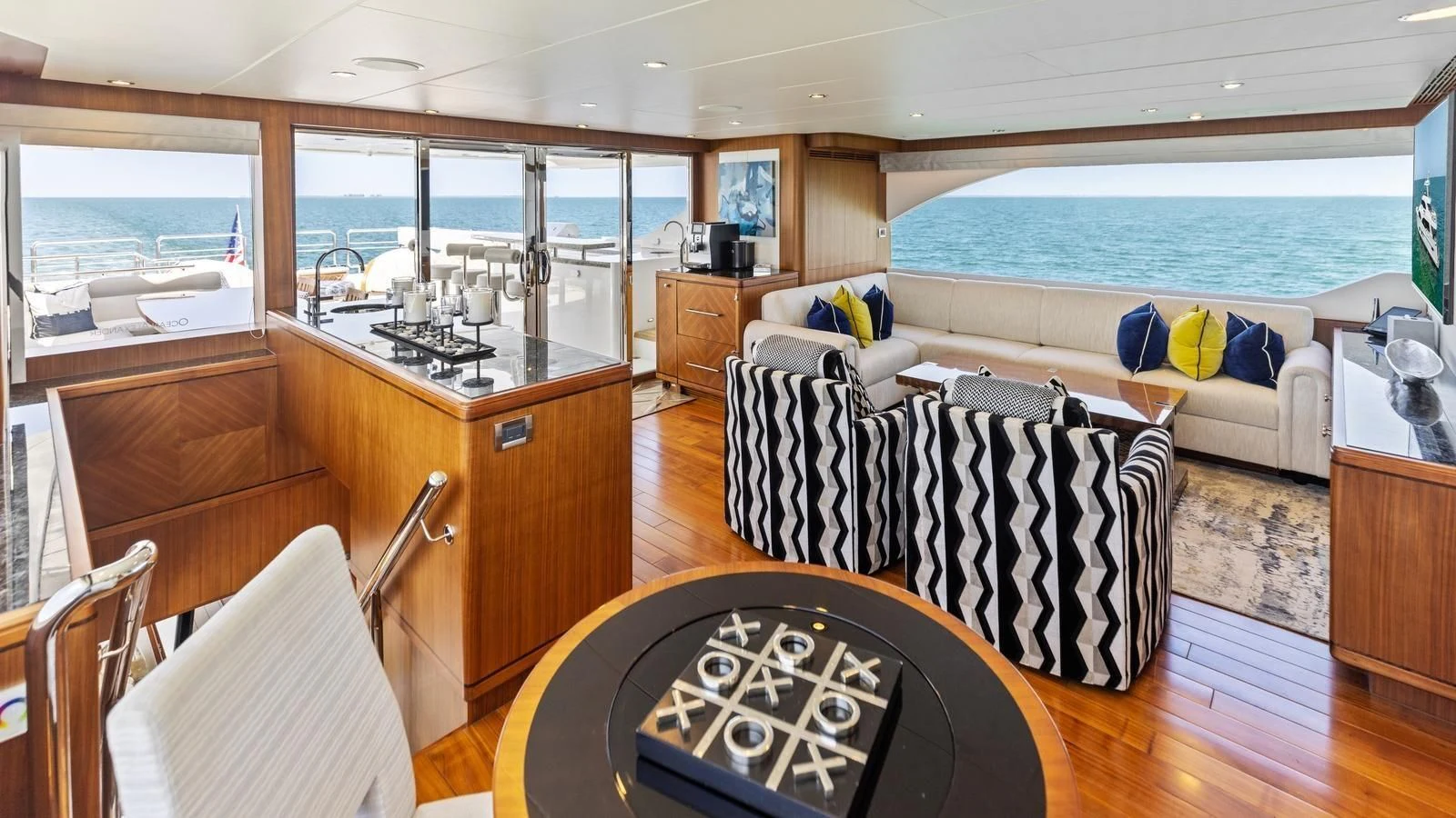 a living room with a couch and a table aboard CLAYMAKER Yacht for Sale