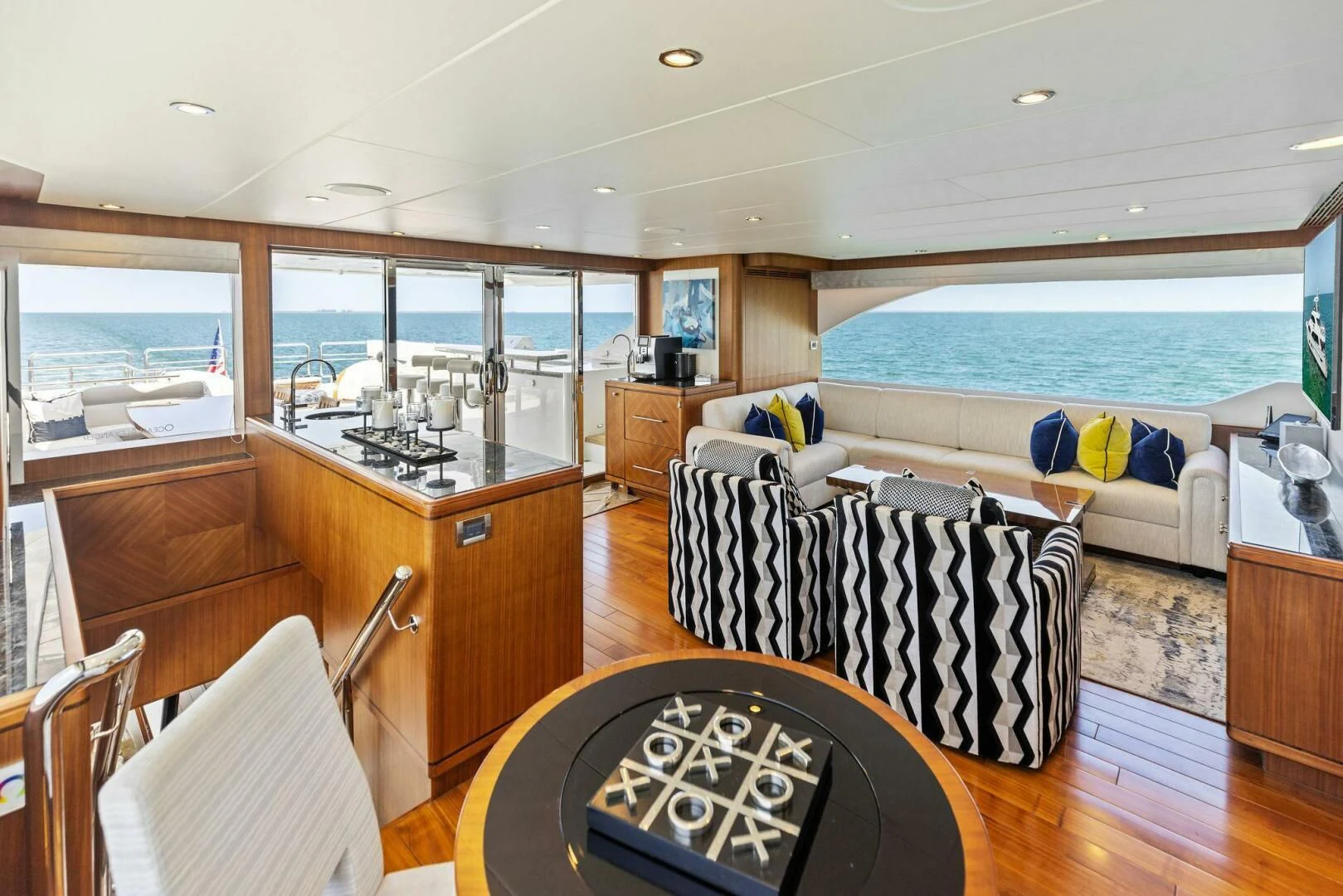 a living room with a large window aboard CLAYMAKER Yacht for Sale