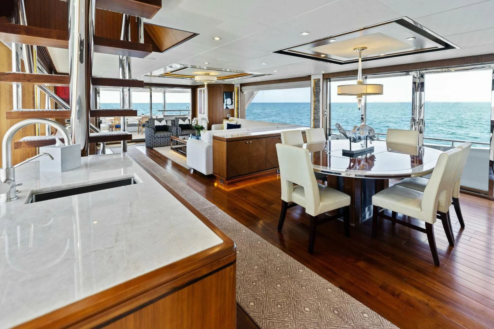 a large open kitchen and dining area aboard CLAYMAKER Yacht for Sale
