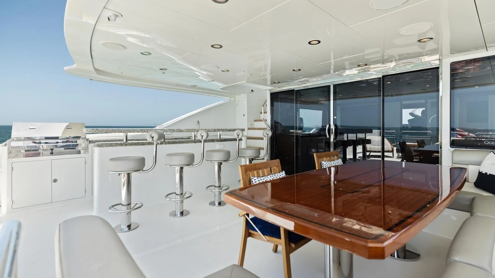 a room with tables and chairs aboard CLAYMAKER Yacht for Sale