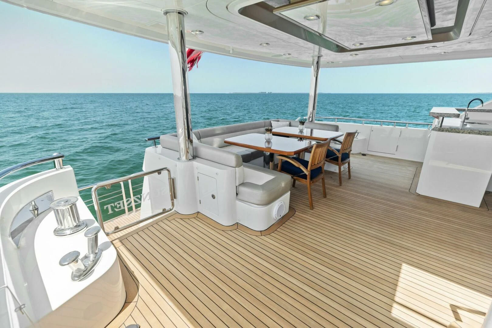 a deck with a sink and a table on it aboard CLAYMAKER Yacht for Sale