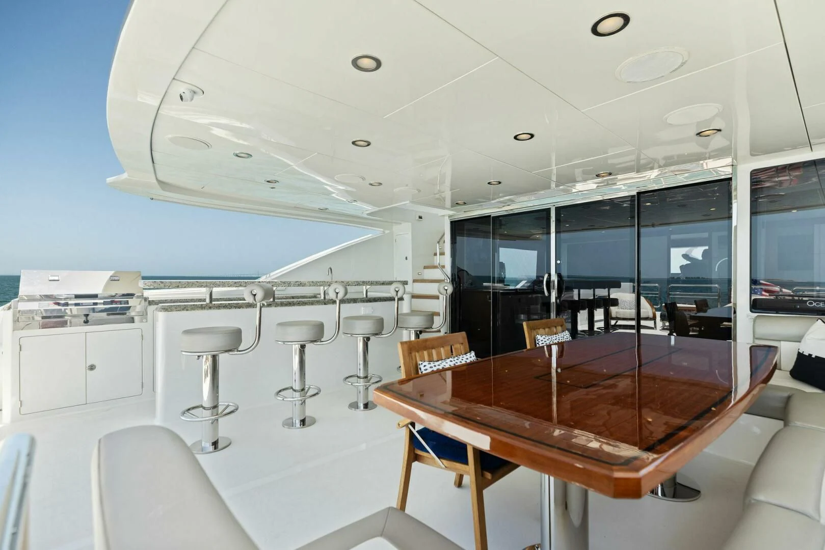 a room with tables and chairs aboard CLAYMAKER Yacht for Sale