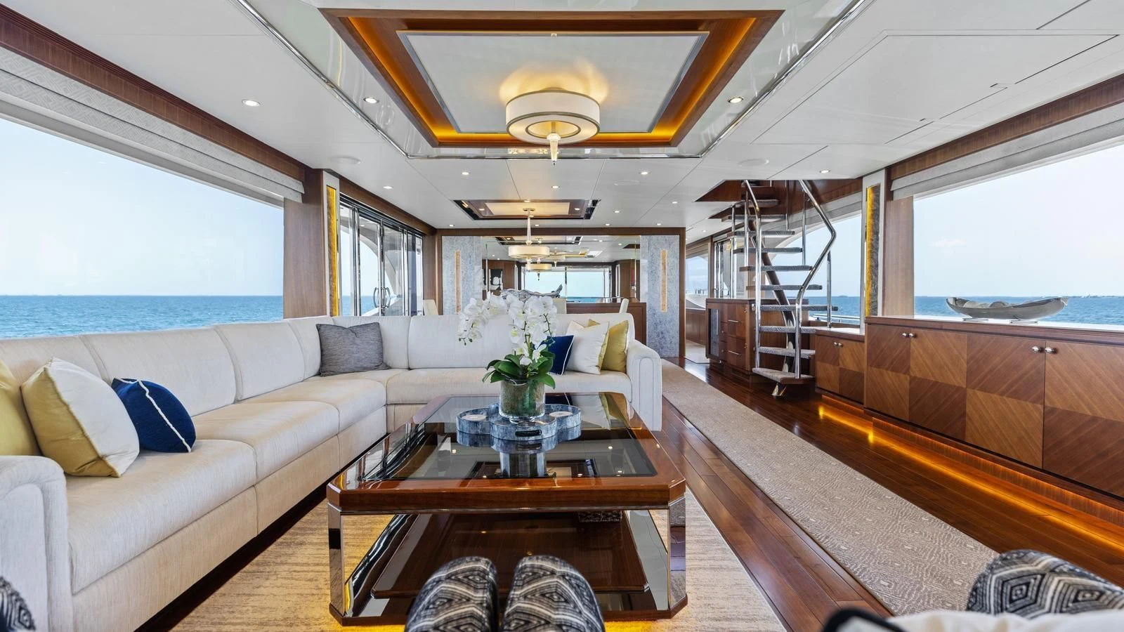 a living room with a couch and a coffee table aboard CLAYMAKER Yacht for Sale