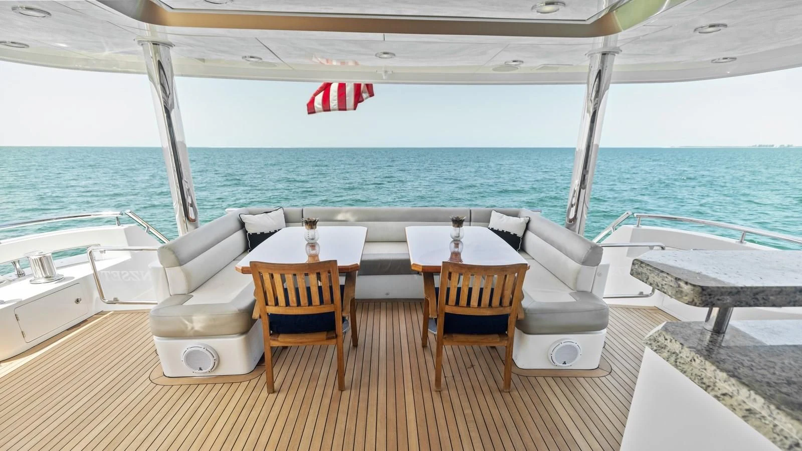 a table and chairs on a deck aboard CLAYMAKER Yacht for Sale