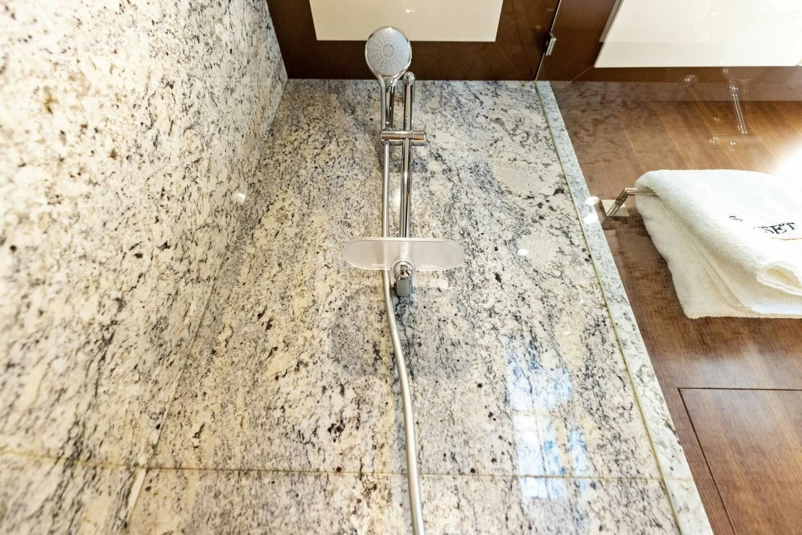 a bathroom with a shower head aboard CLAYMAKER Yacht for Sale