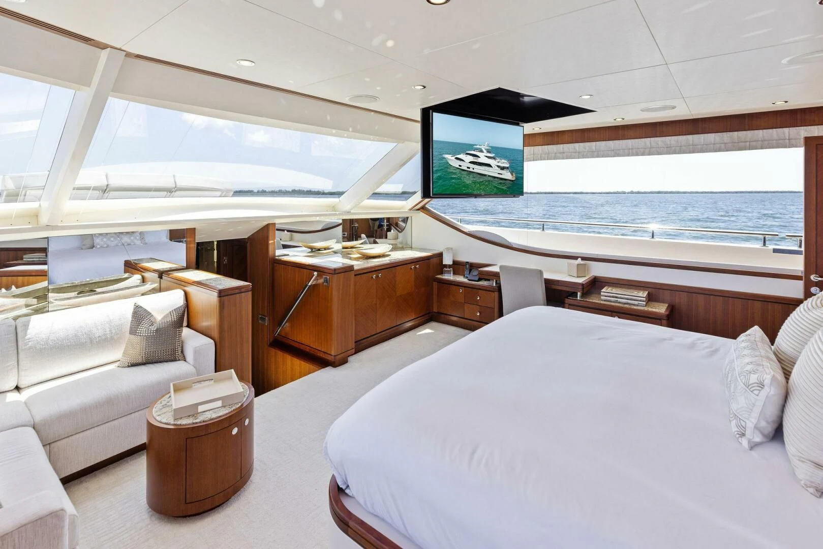 a room with a bed and a television on the wall aboard CLAYMAKER Yacht for Sale
