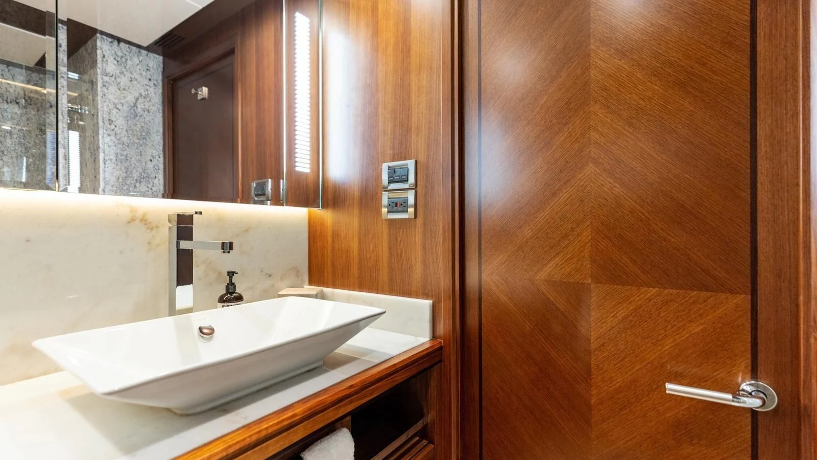a bathroom with a sink and a mirror aboard CLAYMAKER Yacht for Sale
