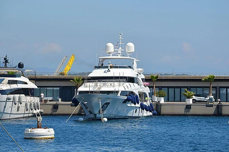 a large white boat sits in the water aboard LADY LILIAN Yacht for Sale