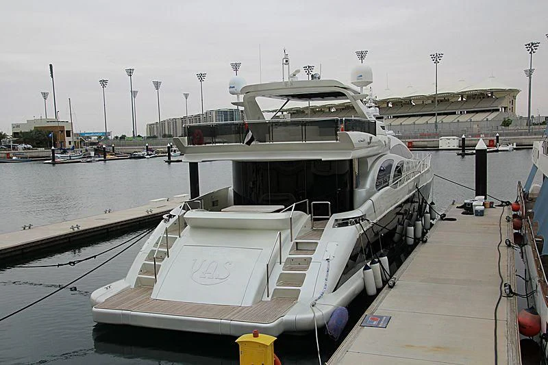 a boat docked at a pier aboard YAS Yacht for Sale