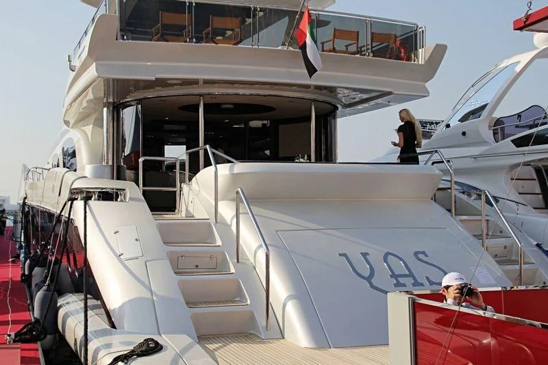 a person standing on a boat aboard YAS Yacht for Sale