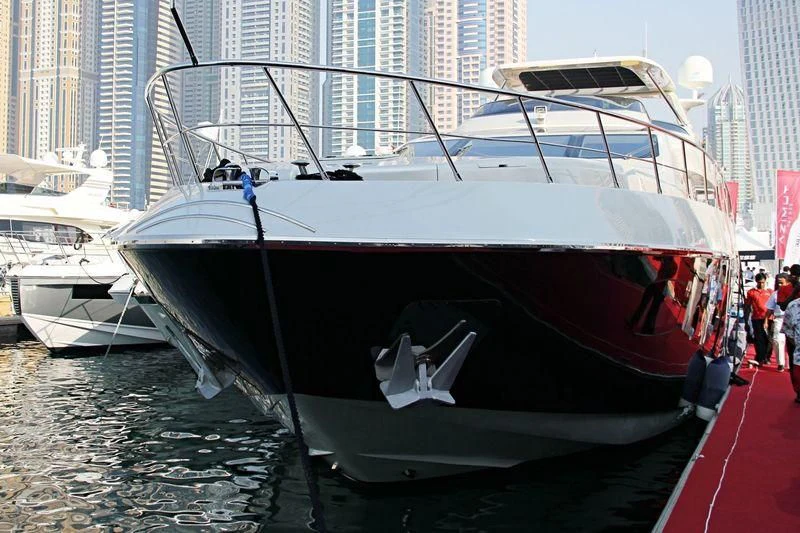 a boat docked at a pier aboard YAS Yacht for Sale