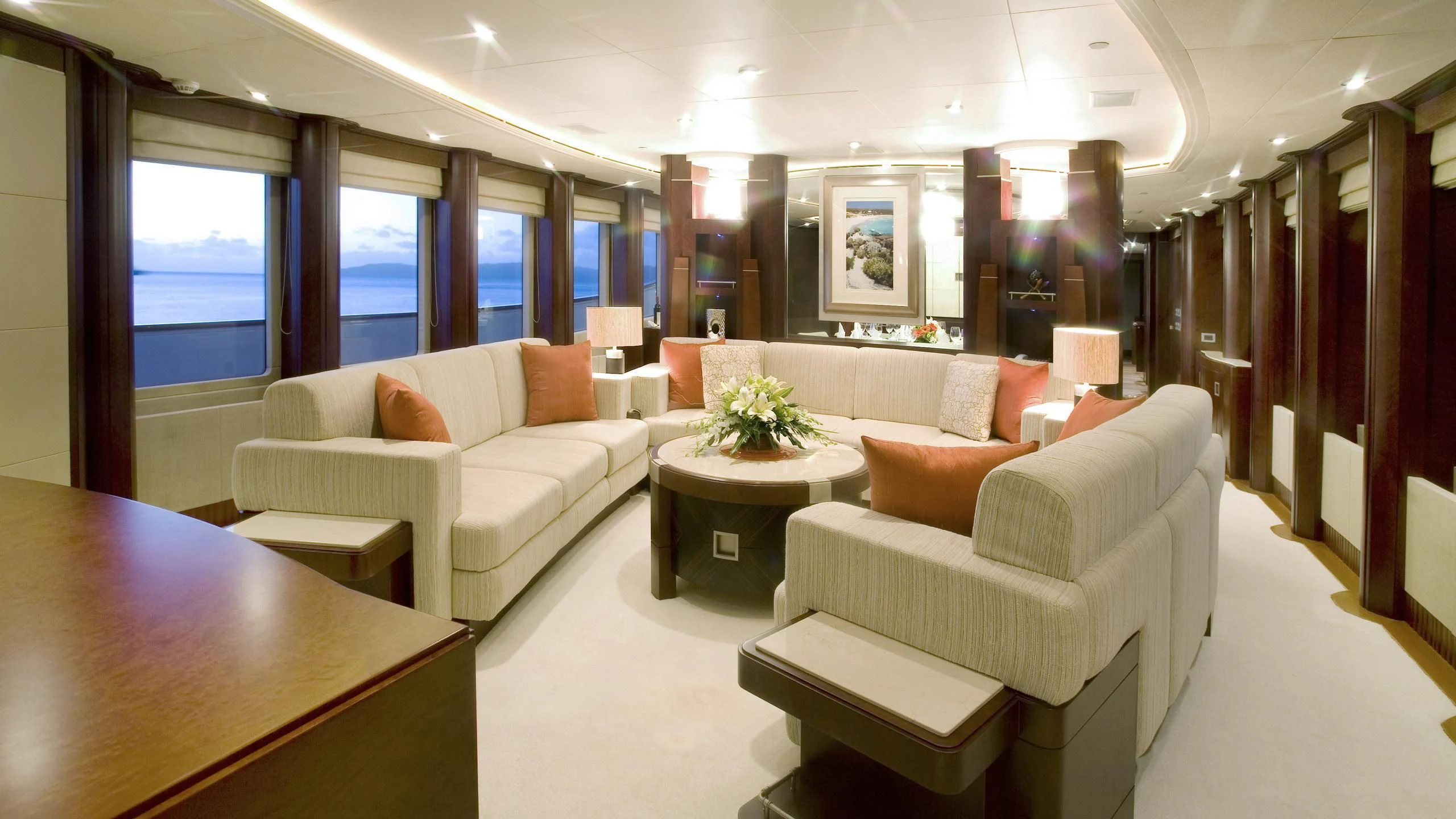 a room with a table chairs and a couch aboard DE LISLE III Yacht for Sale