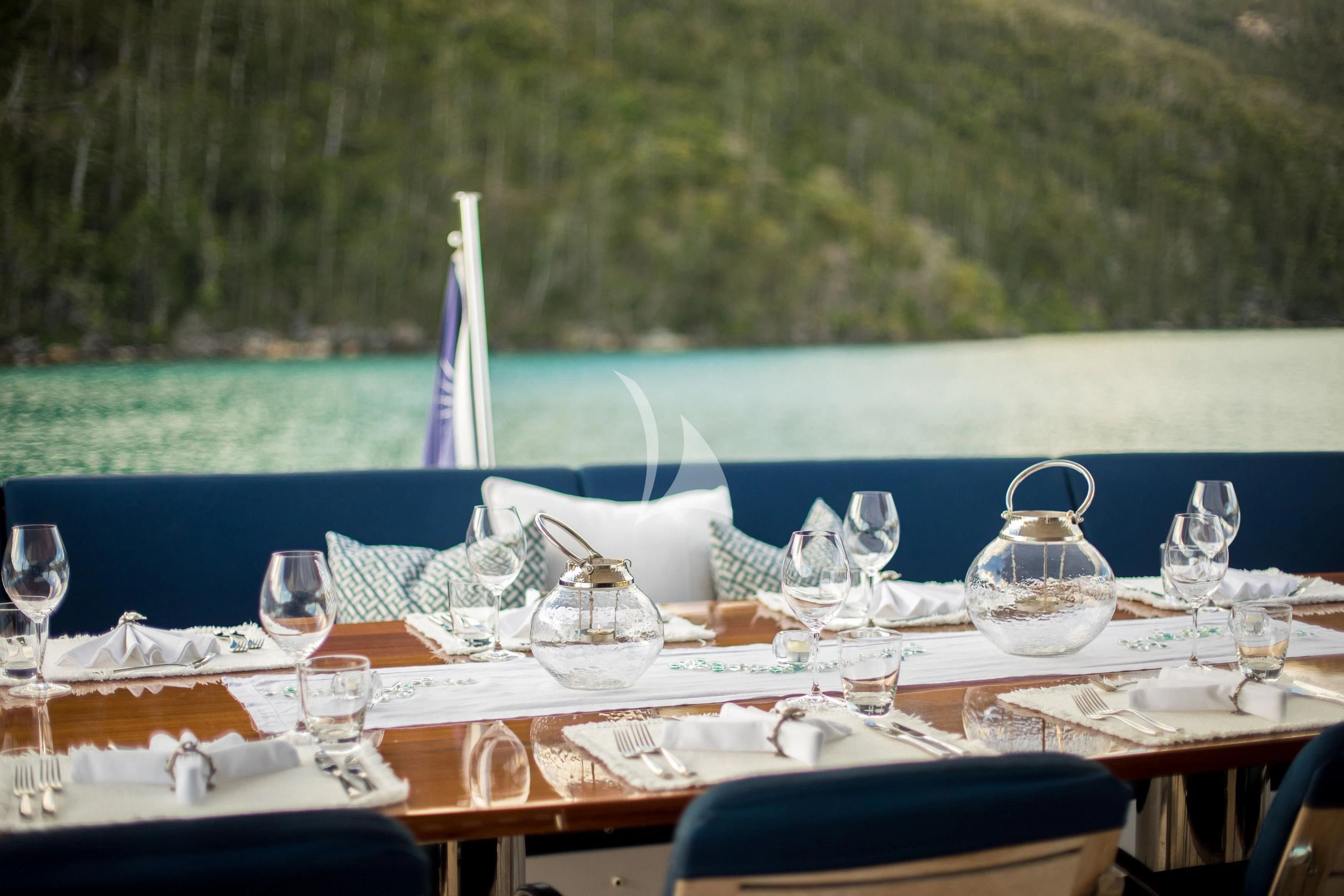 a table set for a dinner aboard DE LISLE III Yacht for Sale