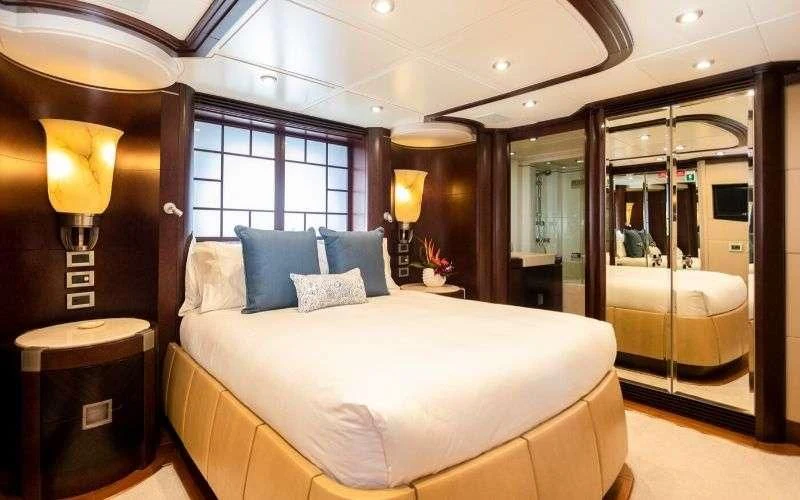 a bed in a hotel room aboard DE LISLE III Yacht for Sale