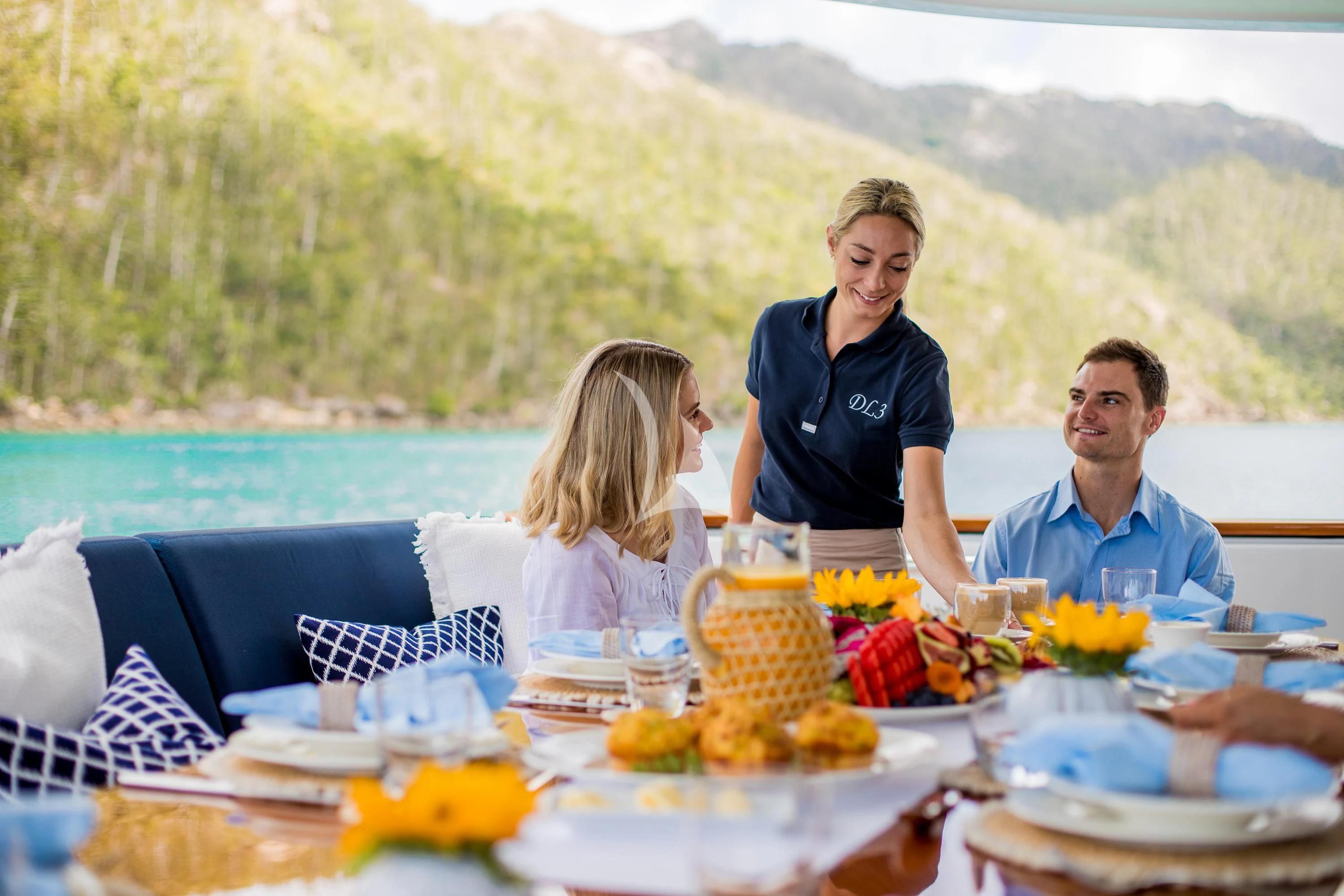 a family having a picnic on a boat aboard DE LISLE III Yacht for Sale