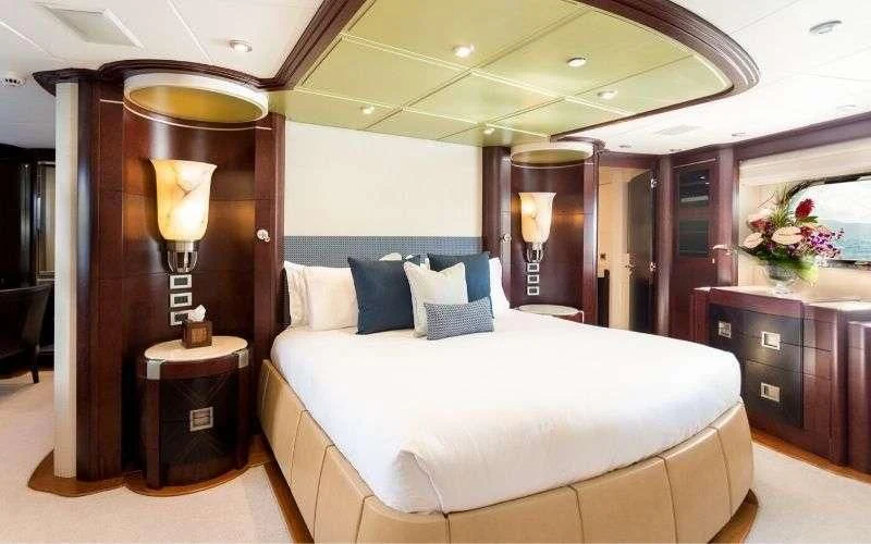 a bed in a hotel room aboard DE LISLE III Yacht for Sale