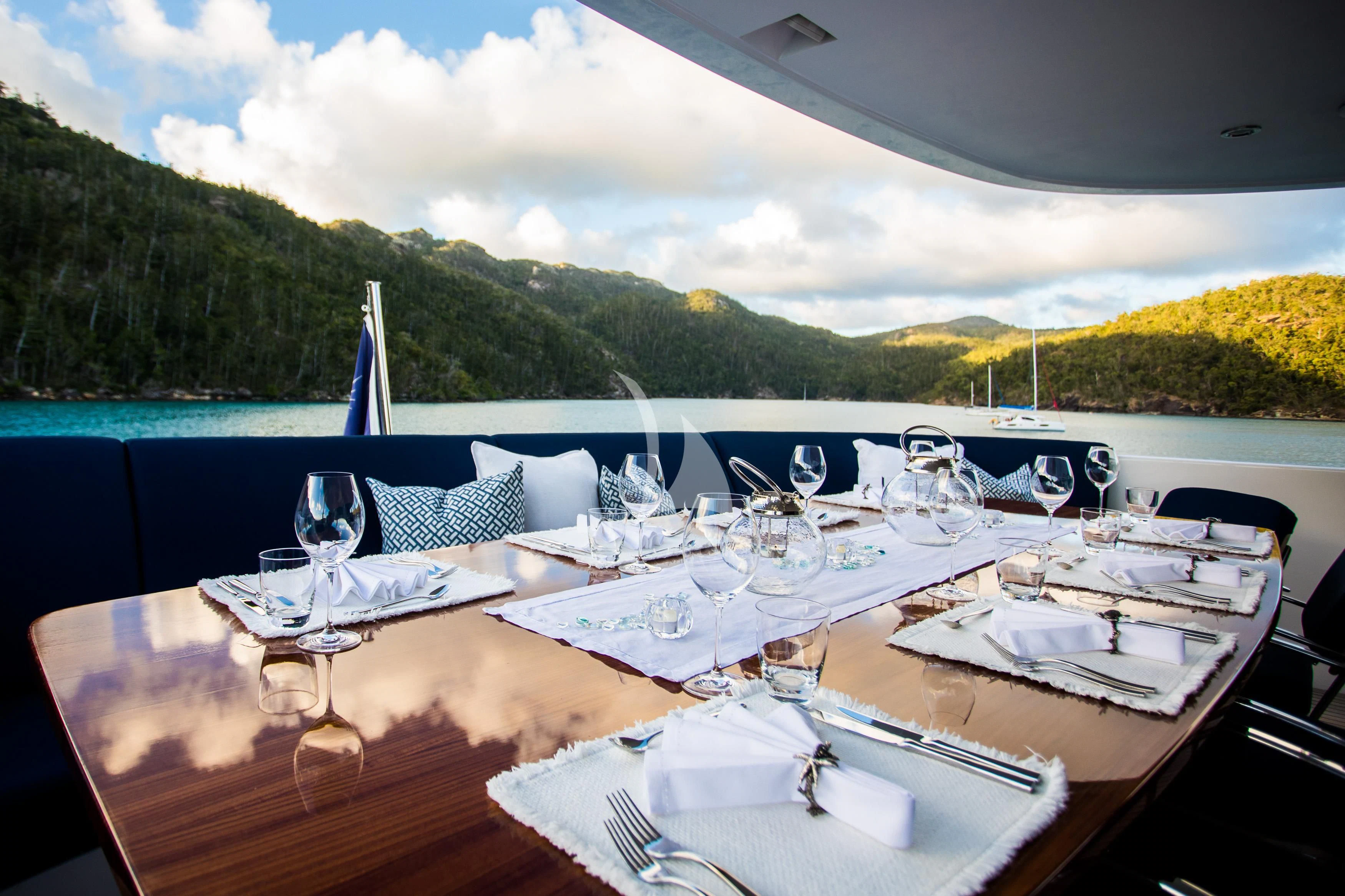 a table set for a dinner aboard DE LISLE III Yacht for Sale