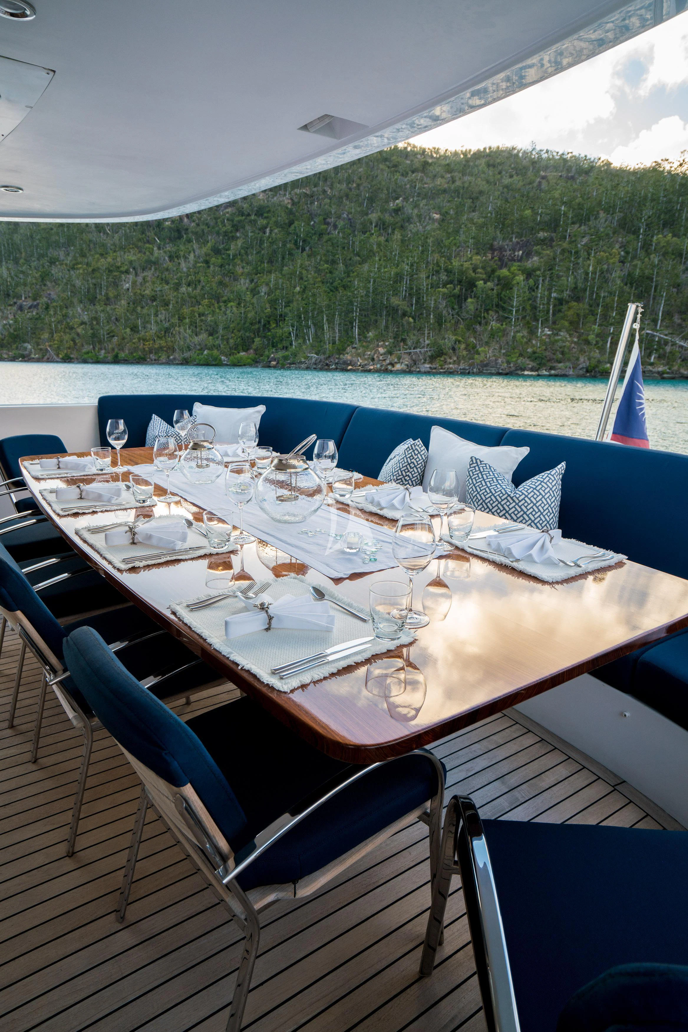 a table set for a dinner on a boat aboard DE LISLE III Yacht for Sale