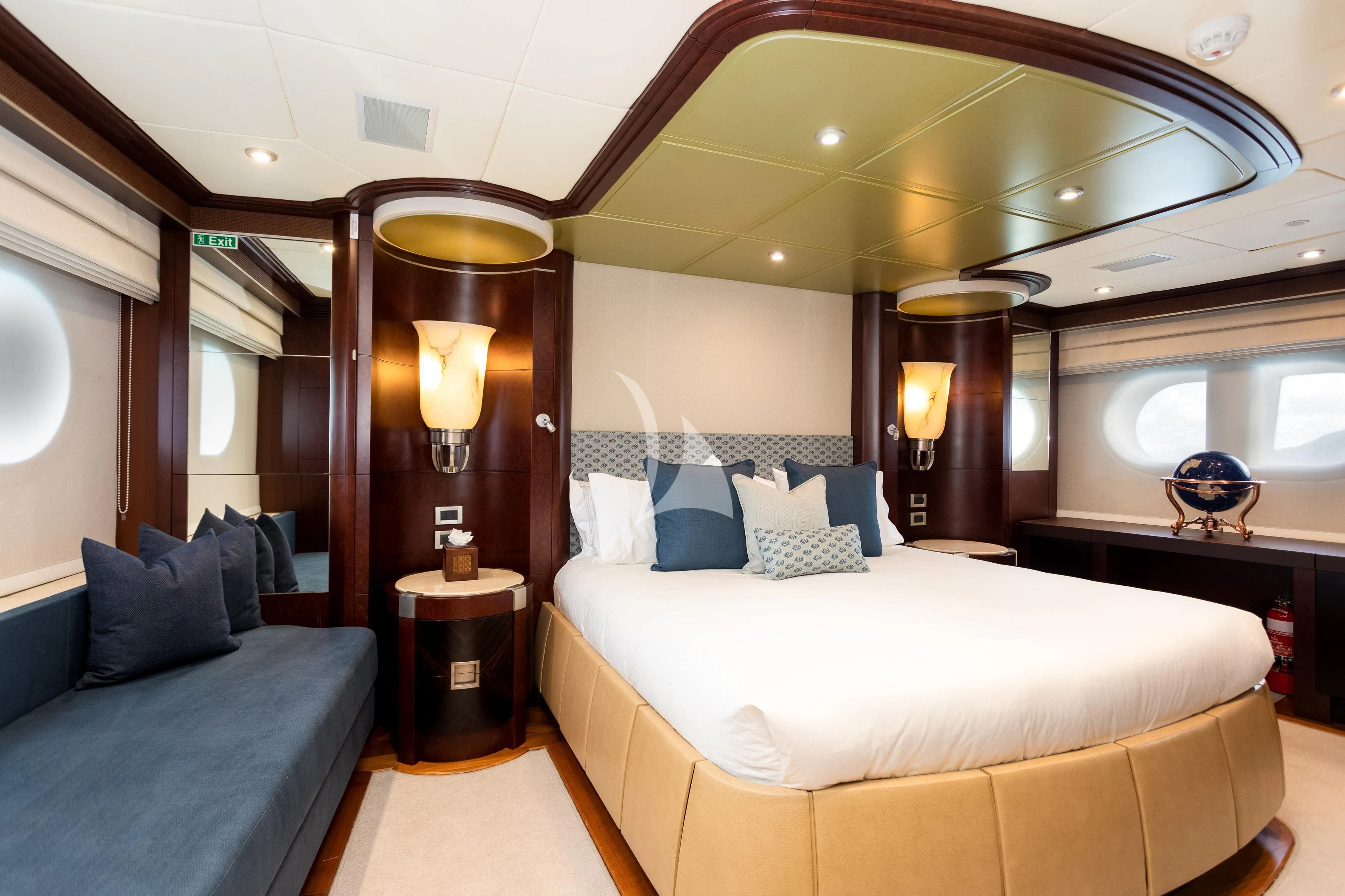 a room with a bed and a lamp aboard DE LISLE III Yacht for Sale