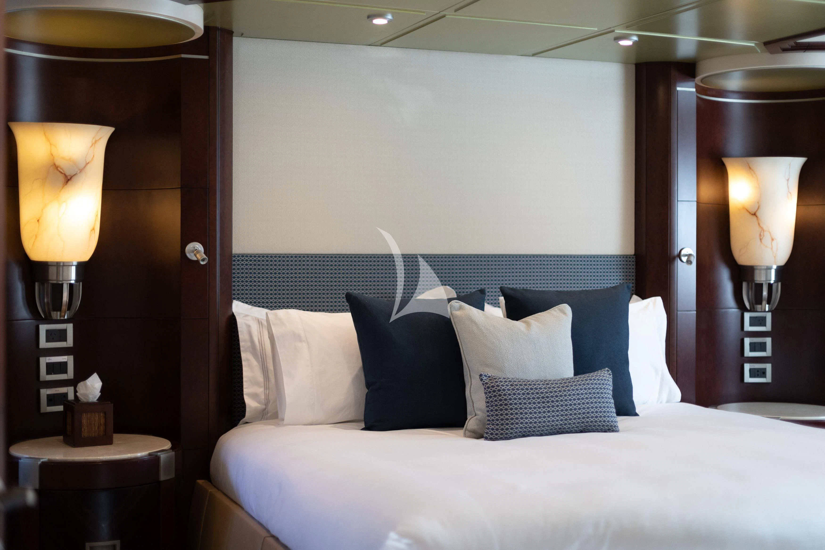 a bed with pillows and pillows aboard DE LISLE III Yacht for Sale
