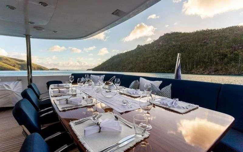 a table set for a dinner on a boat aboard DE LISLE III Yacht for Sale