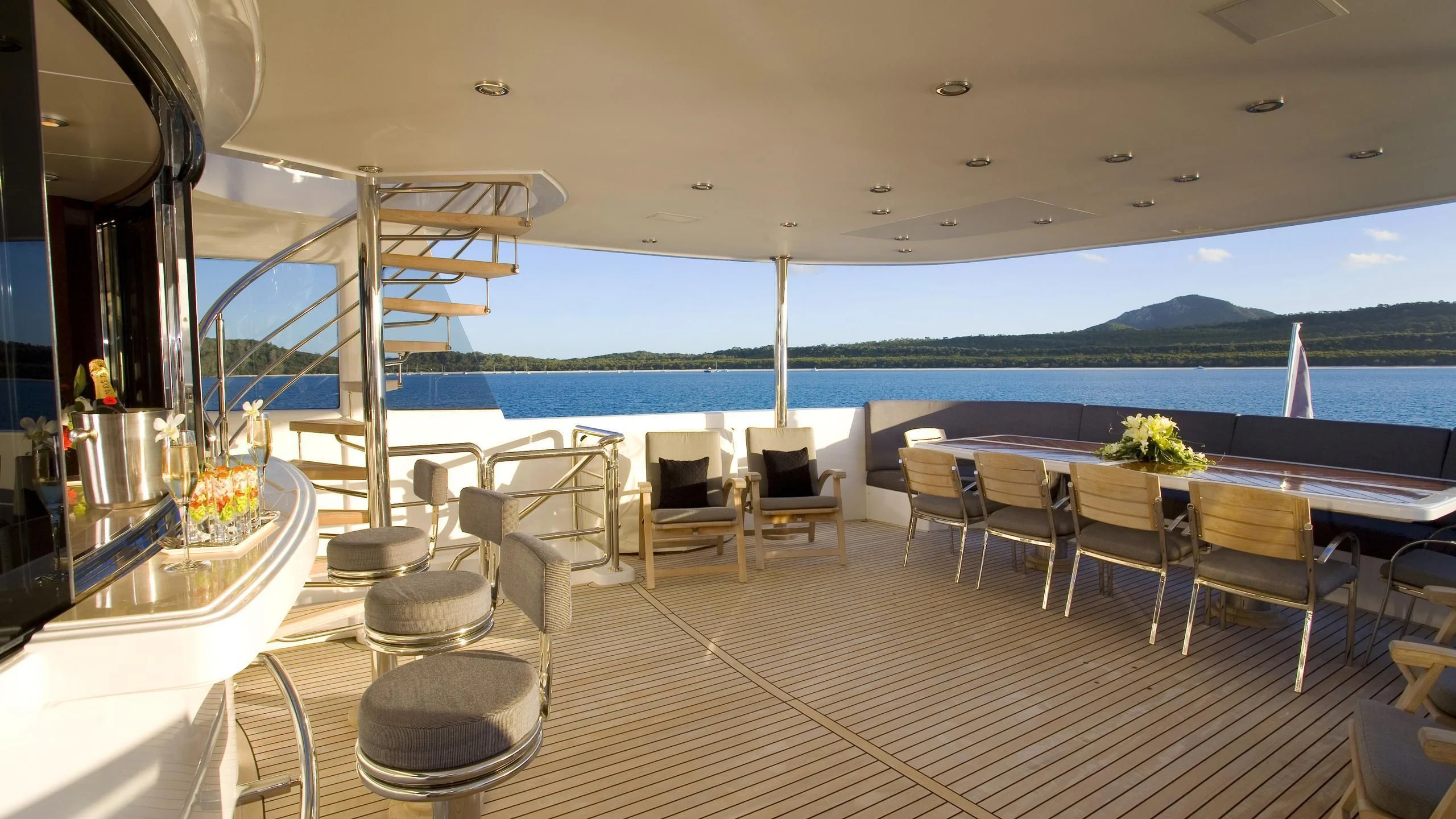 a room with a table and chairs aboard DE LISLE III Yacht for Sale