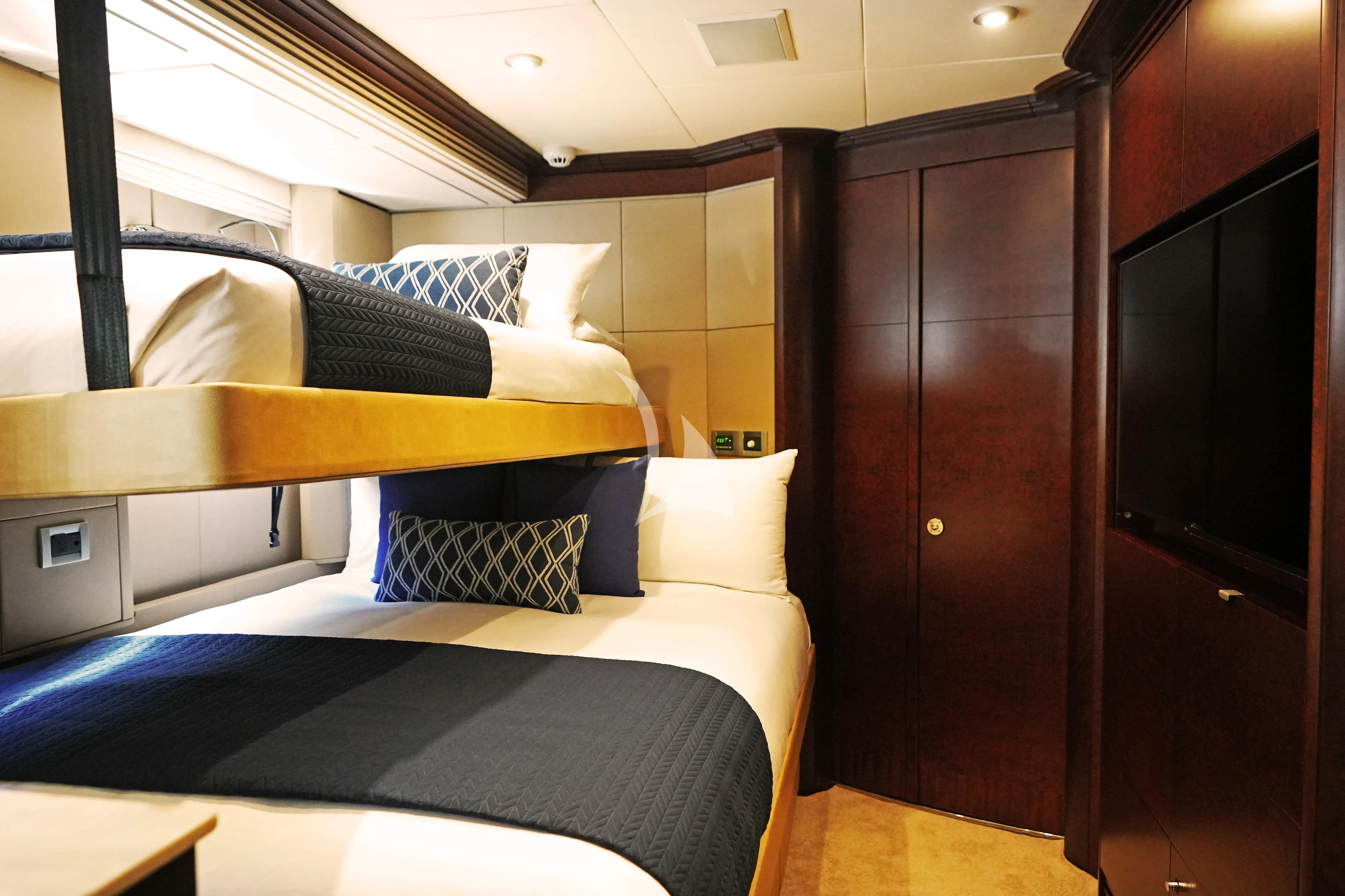 a room with a bed and a desk aboard DE LISLE III Yacht for Sale