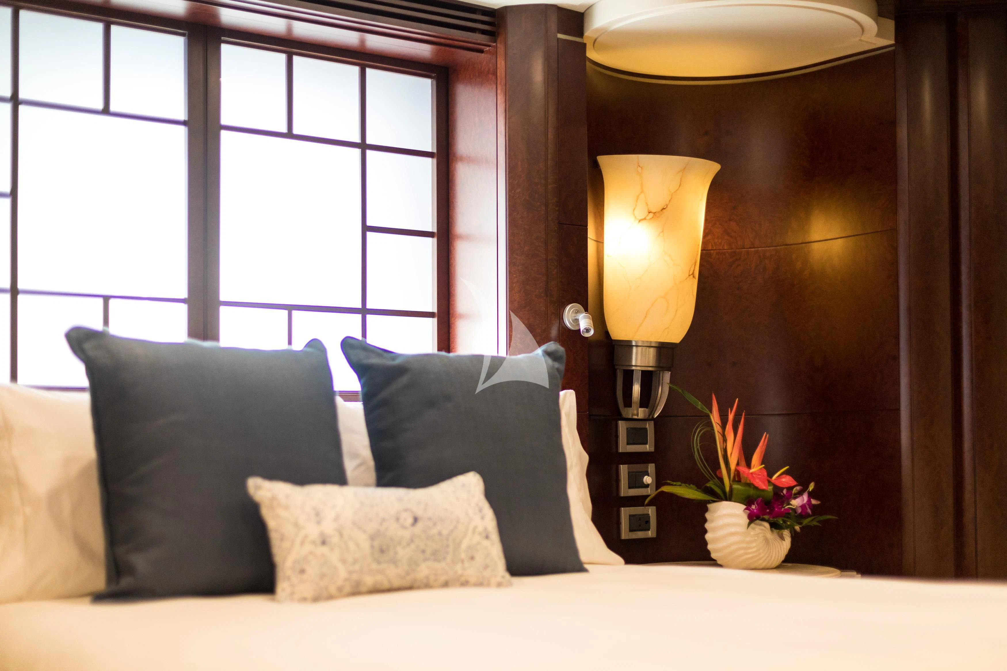 a bed with pillows and pillows aboard DE LISLE III Yacht for Sale