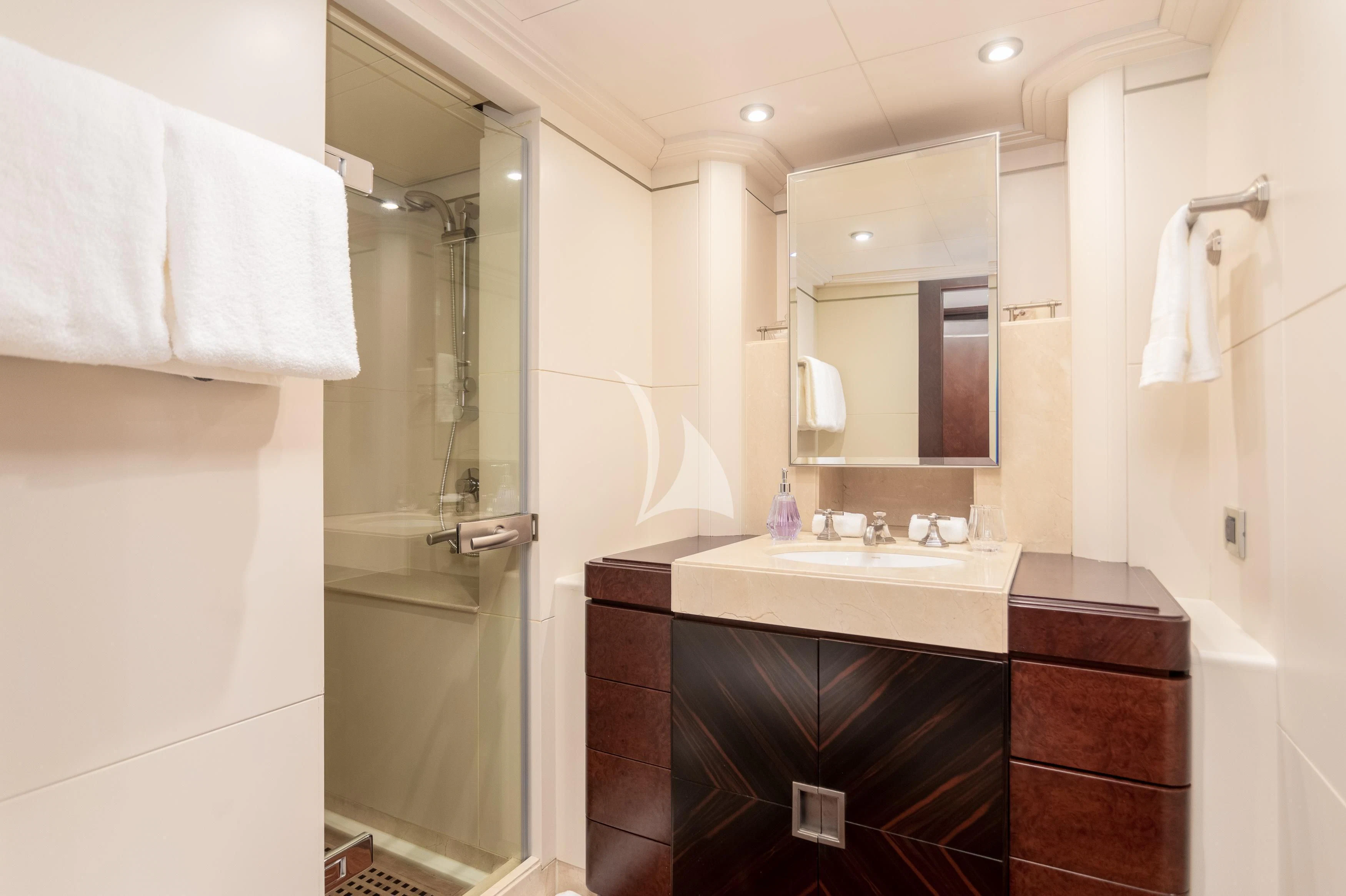 a bathroom with a sink and a shower aboard DE LISLE III Yacht for Sale