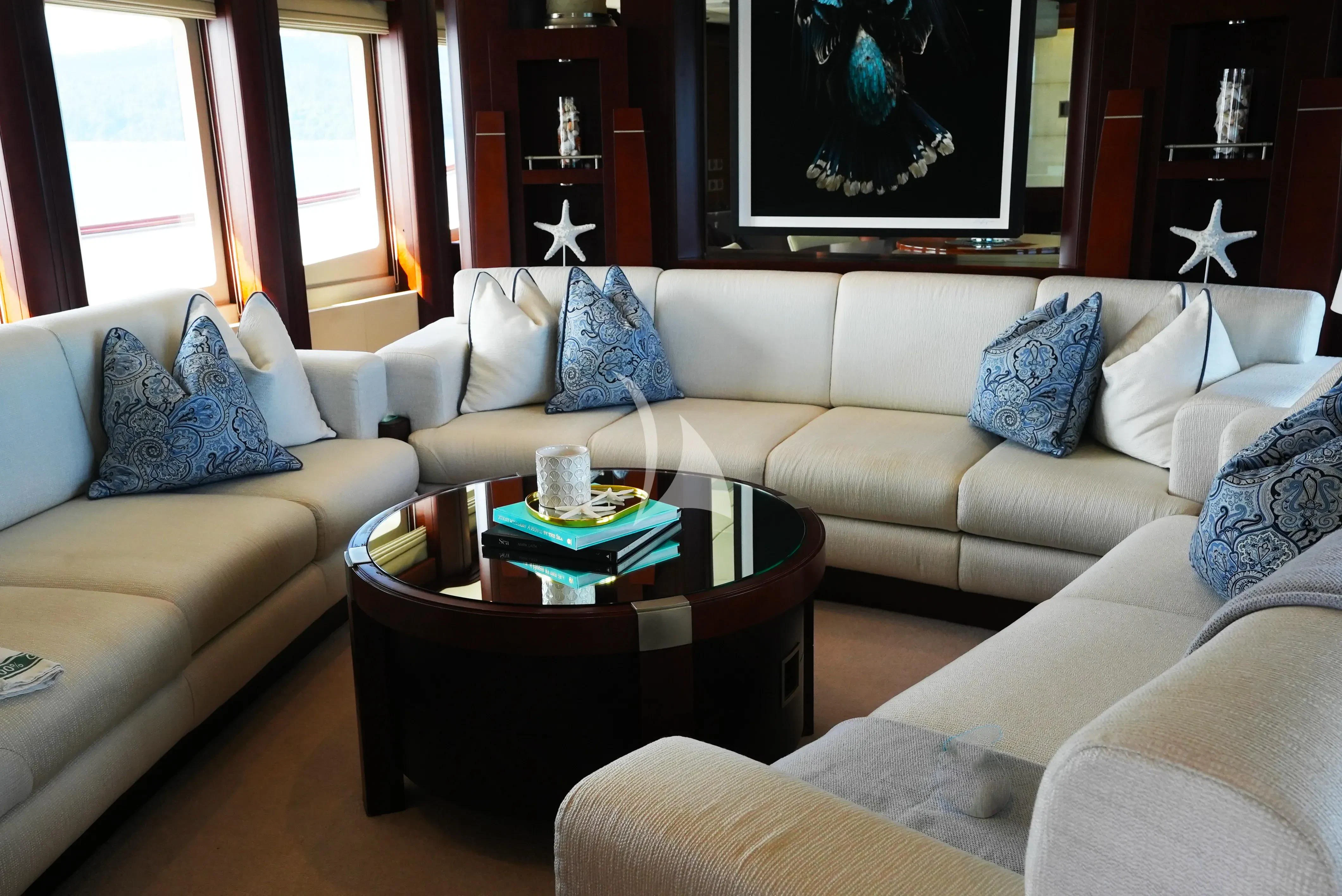 a living room with a couch and a tv aboard DE LISLE III Yacht for Sale