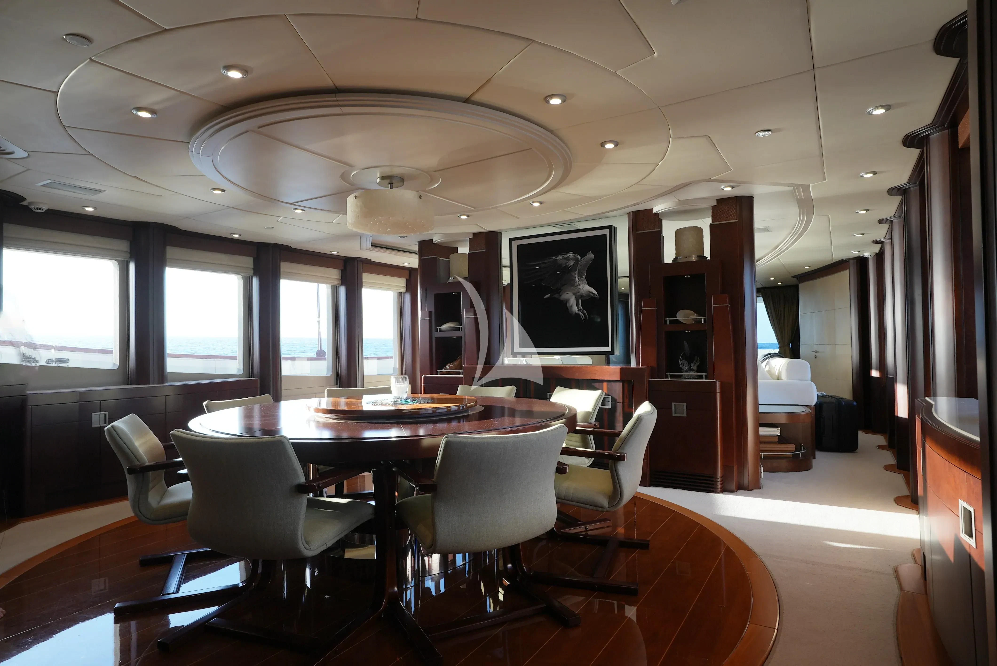 a room with a table chairs and a window aboard DE LISLE III Yacht for Sale