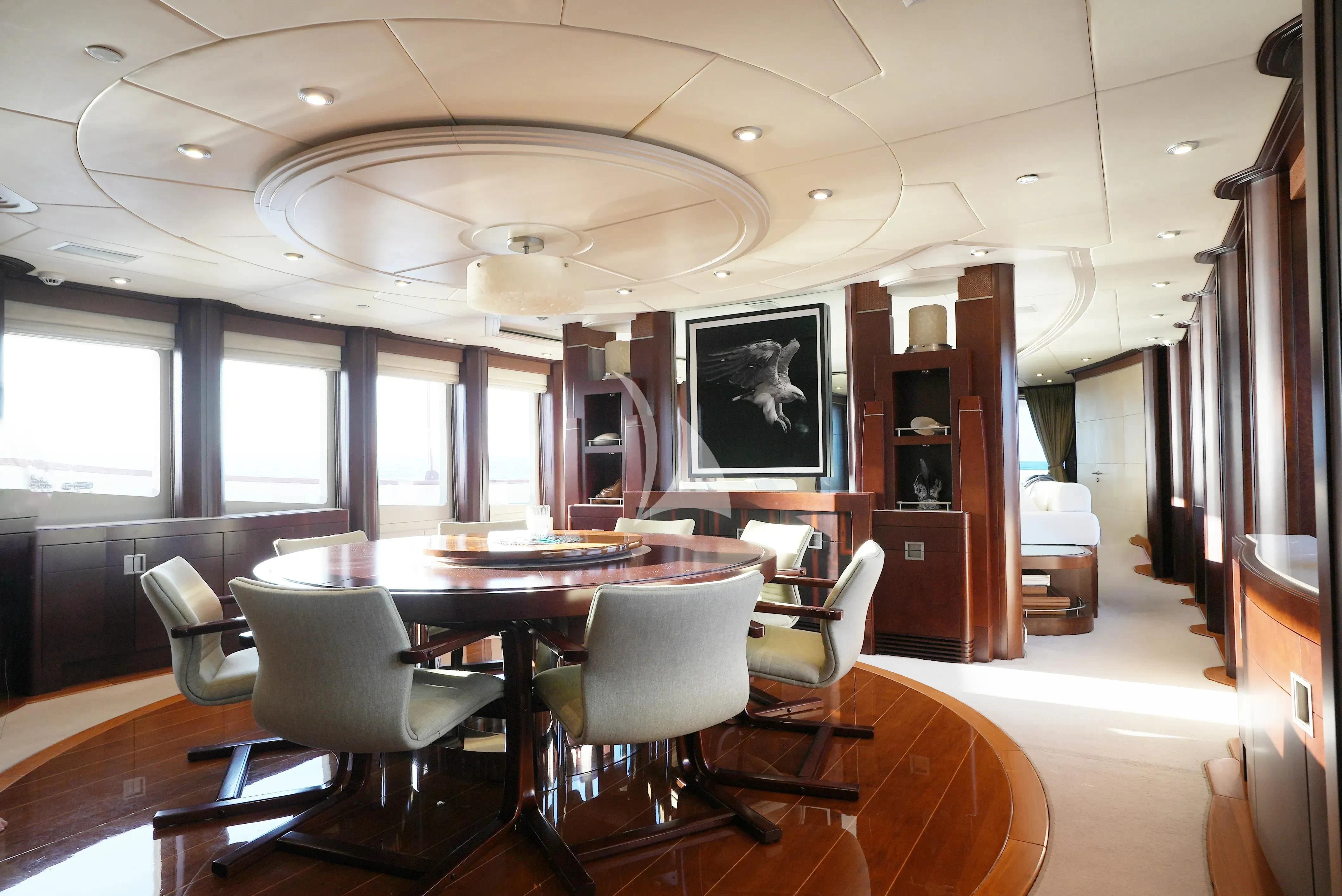 a room with a table chairs and a window aboard DE LISLE III Yacht for Sale